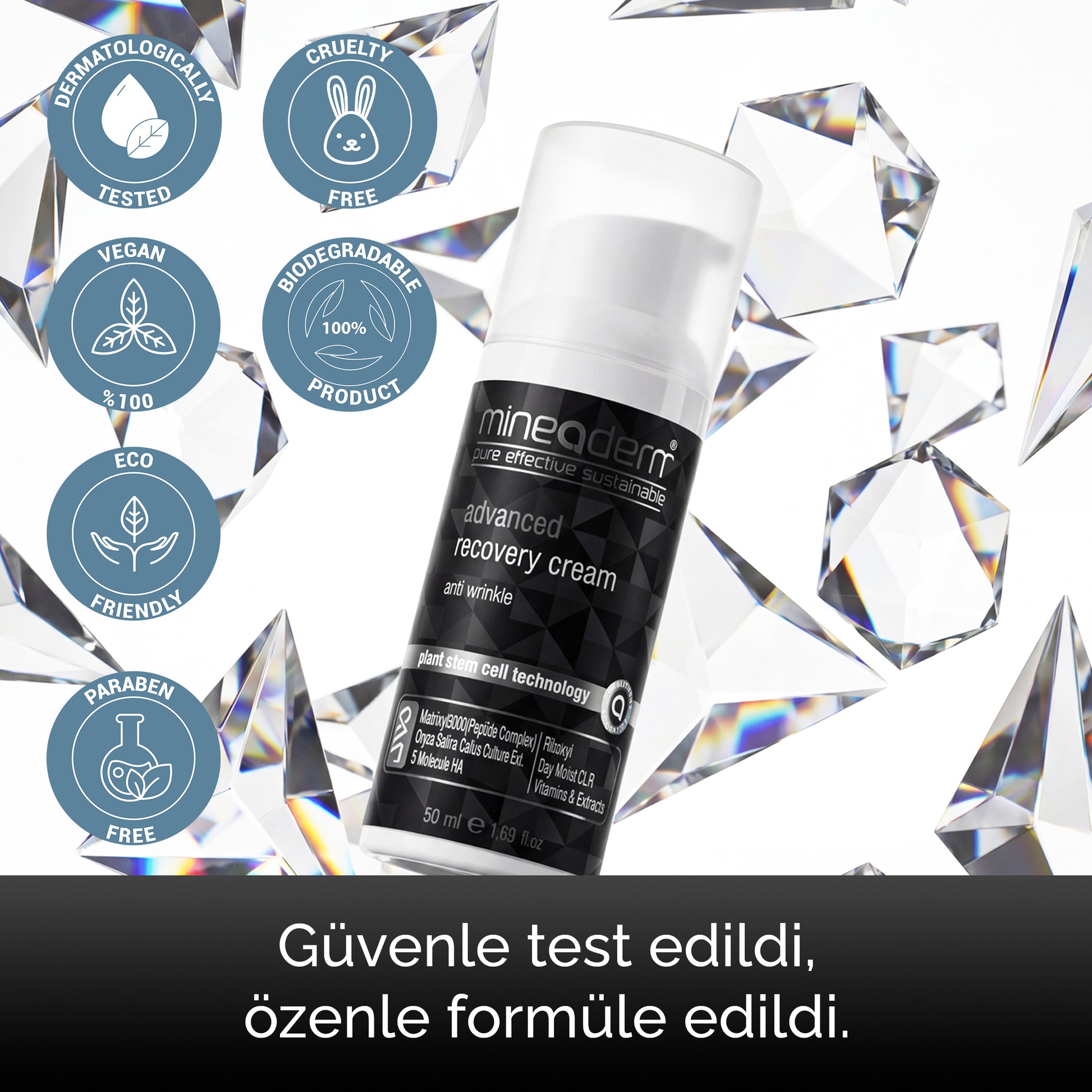 Mineaderm Advanced Recovery Cream şişesi kristallerle; güvenle test edilmiş ve özenle formüle edilmiş sertifika rozetleri: dermatolojik test, cruelty free, vegan, eco friendly ve paraben içermez.