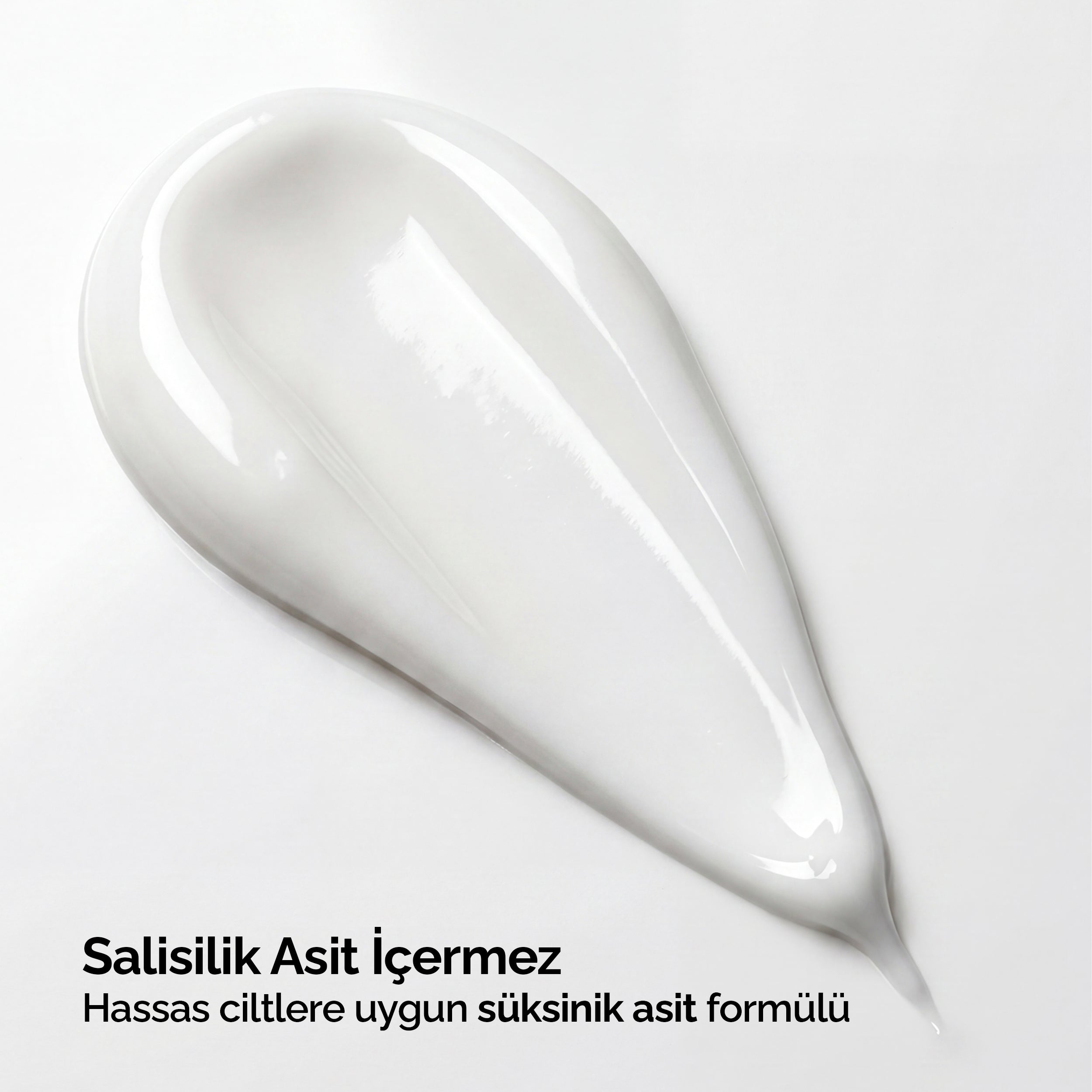 Mineaderm SeboCalm Hydra Cream'in beyaz krem dokusu yakın çekimi; salisilik asit içermeyen, hassas ciltlere uygun süksinik asit formülü.